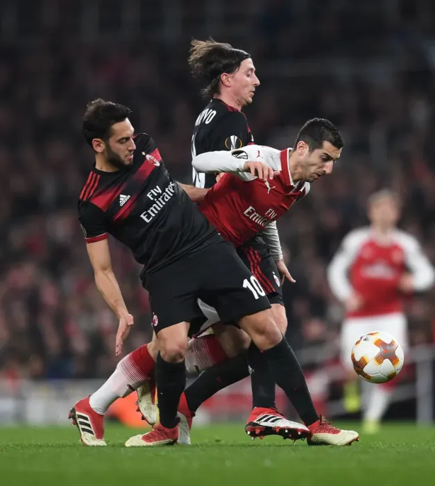 Framed Print : Clash of Midfield Maestros: Mkhitaryan vs Calhanoglu & Montolivo in Arsenal vs AC Milan Europa League Showdown