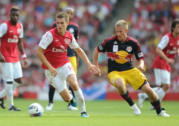 Framed Print : Clash of Midfield Maestros: Aaron Ramsey vs. Dax McCarthy during the Arsenal-New York Red Bulls 2011-12 Emirates Cup Face-Off