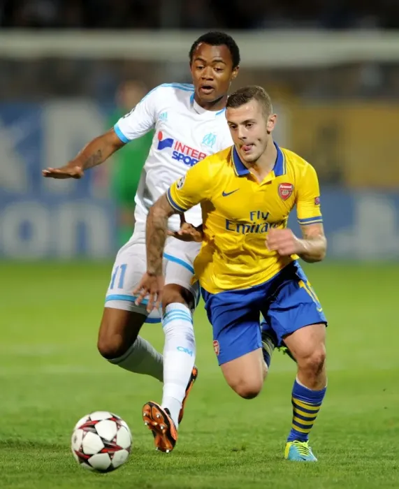 Framed Print : Clash of Midfield Maestros: Jack Wilshere vs. Jordan Ayew, Marseille vs. Arsenal, UEFA Champions League, 2013