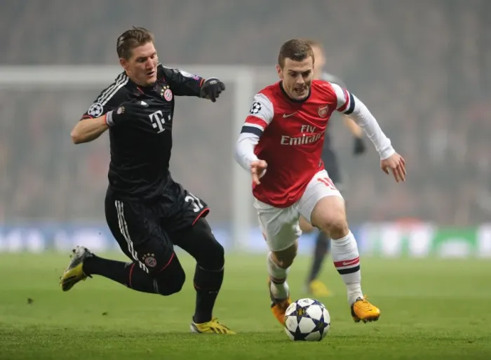 Framed Print : Clash of Midfield Maestros: Jack Wilshere vs Bastian Schweinsteiger (Arsenal v Bayern Munich, 2013 Champions League)