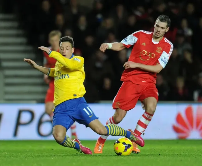 Framed Print : Clash of Midfield Maestros: Ozil vs. Schneiderlin, Southampton vs. Arsenal, Premier League 2013-14 Framed Print : Clash of Midfield Maestros: Ozil vs. Schneiderlin, Southampton vs. Arsenal, Premier League 2013-14