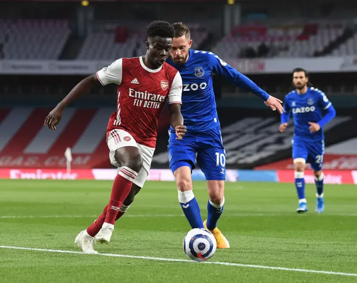 Framed Print : Clash of the Midfield: Saka vs. Sigurdsson - Empty Emirates Stadium Showdown Framed Print : Clash of the Midfield: Saka vs. Sigurdsson - Empty Emirates Stadium Showdown