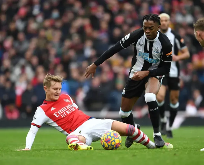 Framed Print : Clash of the Midfield Talents: Odegaard vs. Willock