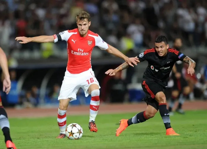 Framed Print : Clash of Midfield Titans: Aaron Ramsey vs. Ramon Motta in Arsenal's UEFA Champions League Showdown against Besiktas Framed Print : Clash of Midfield Titans: Aaron Ramsey vs. Ramon Motta in Arsenal's UEFA Champions League Showdown against Besiktas