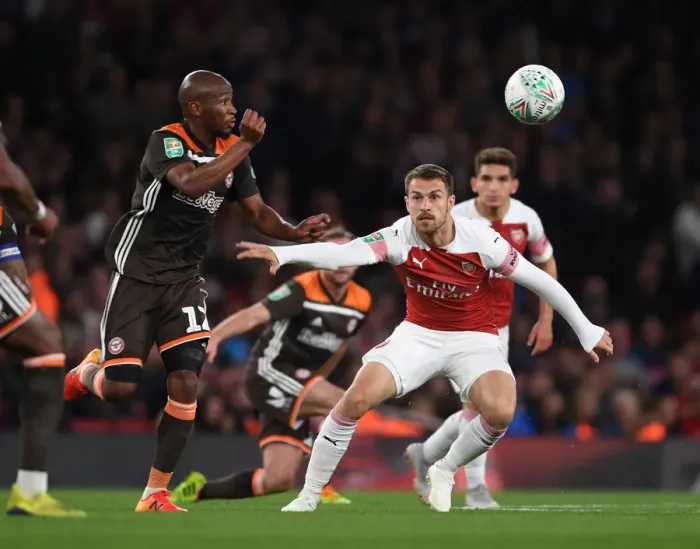 Framed Print : Clash of Midfield Titans: Aaron Ramsey vs. Kamohelo Mokotjo in Arsenal's Carabao Cup Battle Framed Print : Clash of Midfield Titans: Aaron Ramsey vs. Kamohelo Mokotjo in Arsenal's Carabao Cup Battle