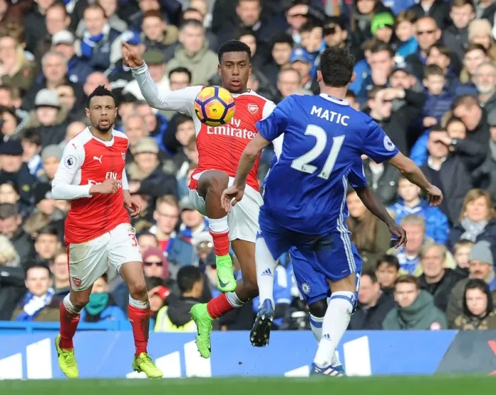 Framed Print : Clash of Midfield Titans: Iwobi vs. Matic in Chelsea vs. Arsenal Premier League Showdown