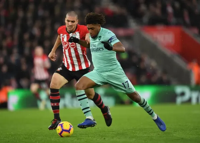 Framed Print : Clash of Midfield Titans: Iwobi vs. Romeu - A Premier League Showdown