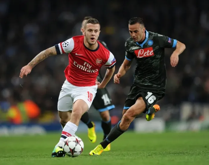 Framed Print : Clash of Midfield Titans: Jack Wilshere vs. Giandomenico Mesto - Arsenal vs. Napoli, UEFA Champions League, 2013
