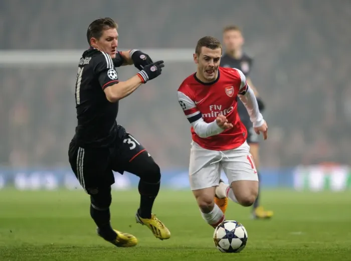 Framed Print : Clash of Midfield Titans: Jack Wilshere vs Bastian Schweinsteiger (Arsenal v Bayern Munich, 2013)
