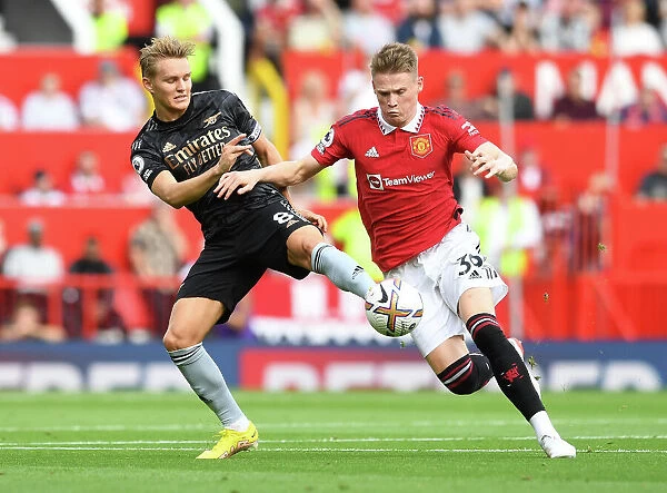 Clash of the Midfield Titans: Odegaard vs McTominay - A Premier League Showdown (Manchester United vs Arsenal, 2022-23)
