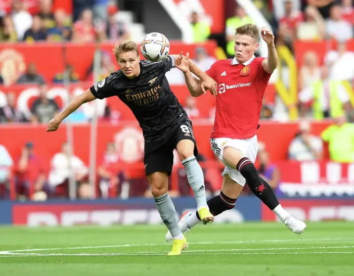 Framed Print : Clash of Midfield Titans: Odegaard vs McTominay - Manchester United vs Arsenal Premier League Showdown Framed Print : Clash of Midfield Titans: Odegaard vs McTominay - Manchester United vs Arsenal Premier League Showdown
