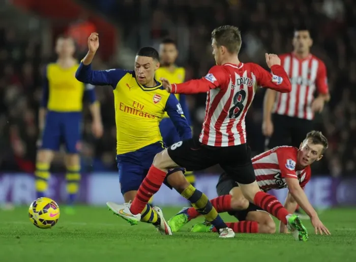 Framed Print : Clash of the Midfield Titans: Oxlade-Chamberlain vs. Ward-Prowse and Davis - Southampton vs. Arsenal, Premier League 2014-15