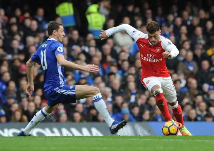 Framed Print : Clash of Midfield Titans: Oxlade-Chamberlain vs. Matic - Arsenal vs. Chelsea Rivalry Framed Print : Clash of Midfield Titans: Oxlade-Chamberlain vs. Matic - Arsenal vs. Chelsea Rivalry