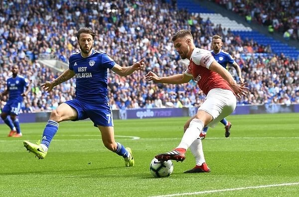 Clash of Midfield Titans: Ramsey vs. Arter in the Intense Cardiff Derby, Premier League 2018-19