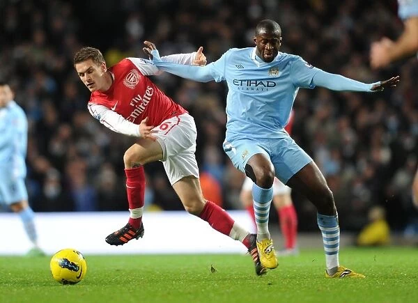 Clash of Midfield Titans: Ramsey vs. Yaya Toure, Manchester City vs. Arsenal, Premier League Showdown (2011-12)