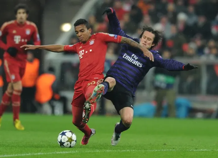 Framed Print : Clash of Midfield Titans: Rosicky vs. Gustavo - Bayern Munich vs. Arsenal, UEFA Champions League 2013 Framed Print : Clash of Midfield Titans: Rosicky vs. Gustavo - Bayern Munich vs. Arsenal, UEFA Champions League 2013