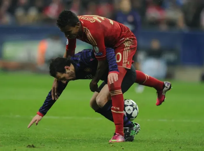 Framed Print : Clash of Midfield Titans: Santi Cazorla vs. Luiz Gustavo - Bayern Munich vs. Arsenal, UEFA Champions League 2013