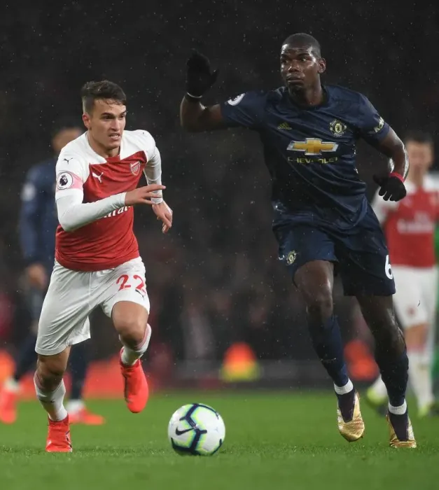 Framed Print : Clash of Midfield Titans: Suarez vs. Pogba - Arsenal vs. Manchester United, Premier League Framed Print : Clash of Midfield Titans: Suarez vs. Pogba - Arsenal vs. Manchester United, Premier League