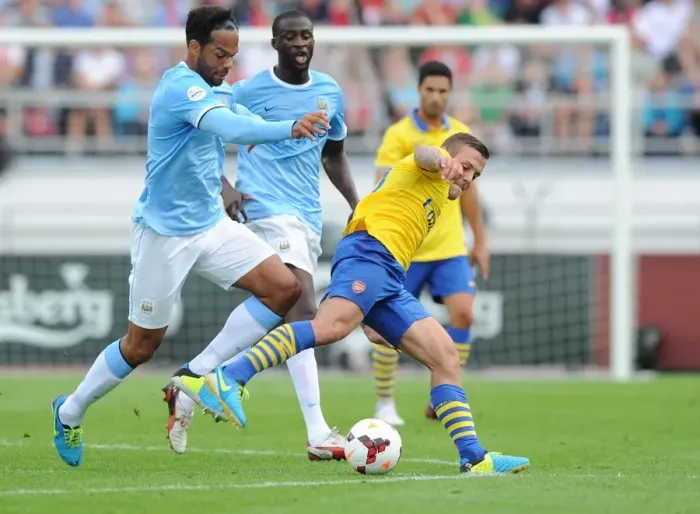 Framed Print : Clash of Midfield Titans: Wilshere vs. Toure & Lescott - Arsenal vs. Manchester City Pre-Season 2013-14 Framed Print : Clash of Midfield Titans: Wilshere vs. Toure & Lescott - Arsenal vs. Manchester City Pre-Season 2013-14