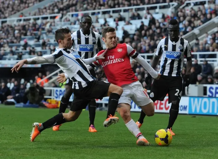 Framed Print : Clash of Midfield Titans: Wilshere vs Cabaye, Sissoko, and Tiote (Newcastle v Arsenal, 2013-14)