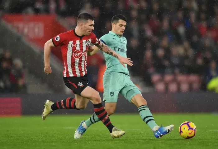Framed Print : Clash of Midfield Titans: Xhaka vs. Hojbjerg - A Battle in the Heart of the Southampton vs. Arsenal Rivalry, Premier League, 2018-19