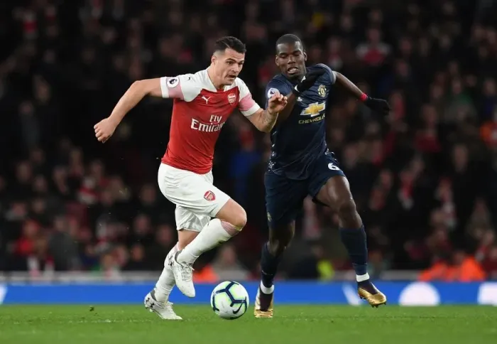 Framed Print : Clash of Midfield Titans: Xhaka vs. Pogba - Arsenal vs. Manchester United, Premier League Framed Print : Clash of Midfield Titans: Xhaka vs. Pogba - Arsenal vs. Manchester United, Premier League