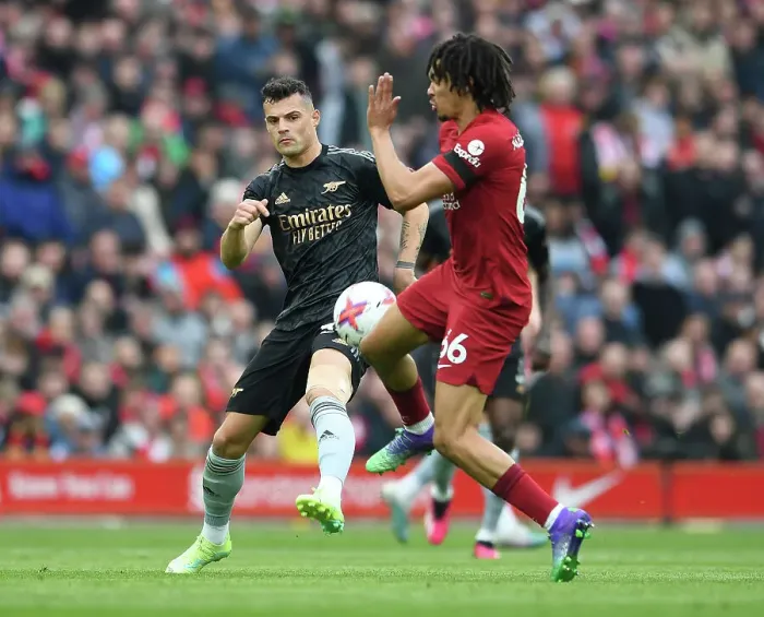 Framed Print : Clash of Midfield Titans: Xhaka vs. Alexander-Arnold - Liverpool's Trent vs. Arsenal's Granit