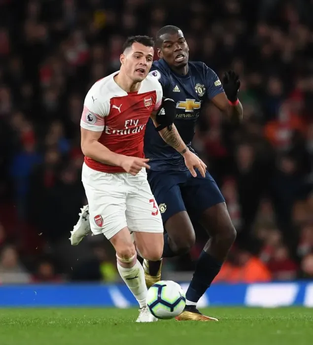 Framed Print : Clash of Midfield Titans: Xhaka vs Pogba - Arsenal vs Manchester United, Premier League Framed Print : Clash of Midfield Titans: Xhaka vs Pogba - Arsenal vs Manchester United, Premier League