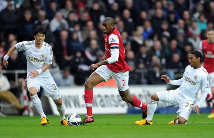 Framed Print : Clash of Midfielders: Abou Diaby vs. Ki Sung-Yueng and Jonathan De Guzman (Swansea City vs. Arsenal, 2012-13) Framed Print : Clash of Midfielders: Abou Diaby vs. Ki Sung-Yueng and Jonathan De Guzman (Swansea City vs. Arsenal, 2012-13)