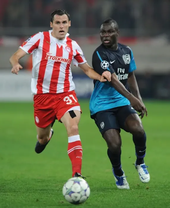 Framed Print : Clash of Midfielders: Frimpong vs. Orbaiz - Olympiacos vs. Arsenal, UEFA Champions League, 2011
