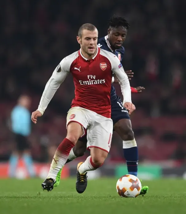 Framed Print : Clash of Midfielders: Jack Wilshere vs. Richmond Donald in Arsenal's Europa League Battle