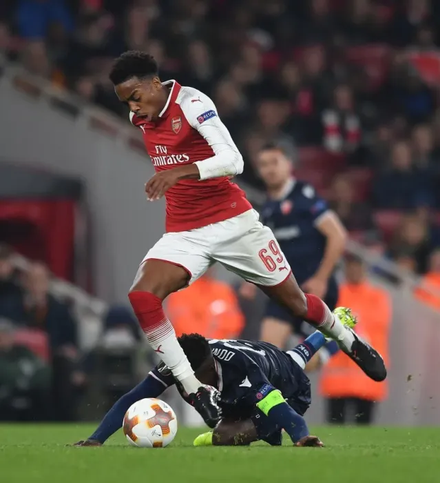 Framed Print : Clash of Midfielders: Joe Willock vs. Mitchell Donald in Arsenal's Europa League Battle Framed Print : Clash of Midfielders: Joe Willock vs. Mitchell Donald in Arsenal's Europa League Battle