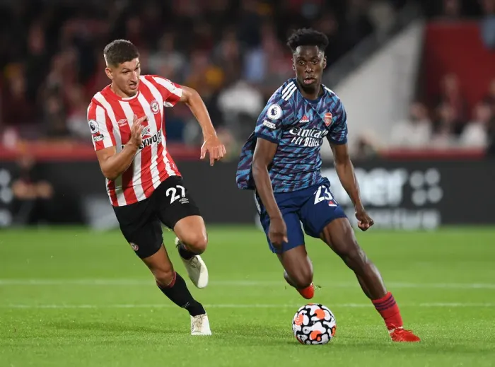 Framed Print : Clash of the Midfielders: Lokonga vs Janelt - Brentford vs Arsenal Premier League Showdown
