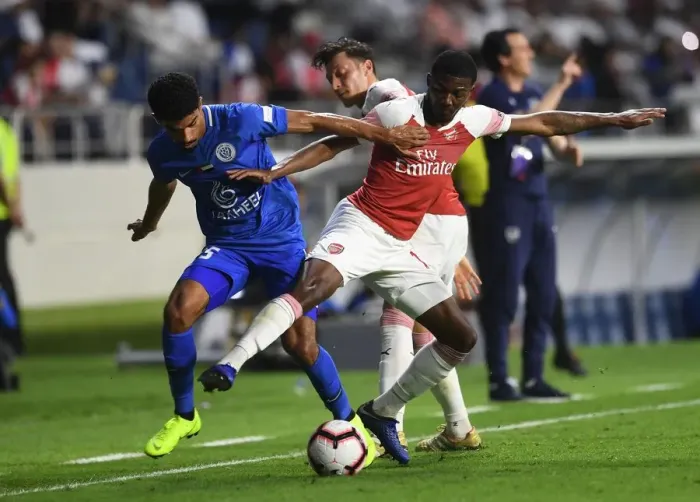 Framed Print : Clash of the Midfielders: Maitland-Niles vs. Saleh (Al-Nasr vs. Arsenal, 2018-19)