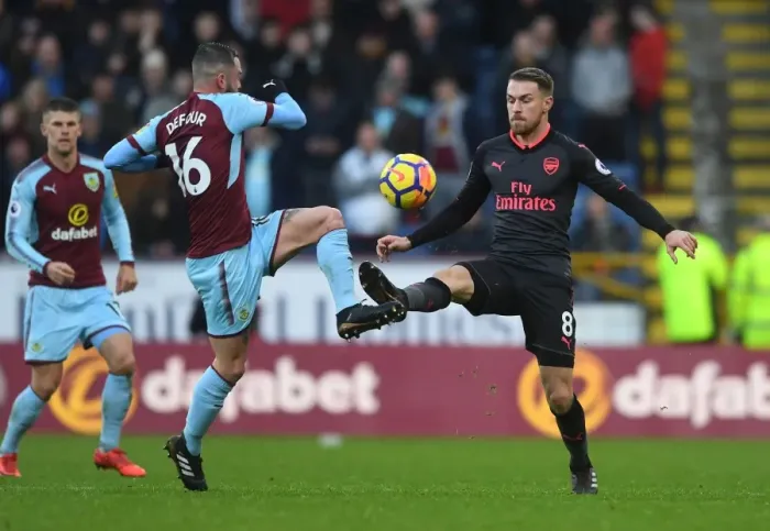 Framed Print : Clash of Midfielders: Ramsey vs Defour - Burnley vs Arsenal, Premier League 2017-18