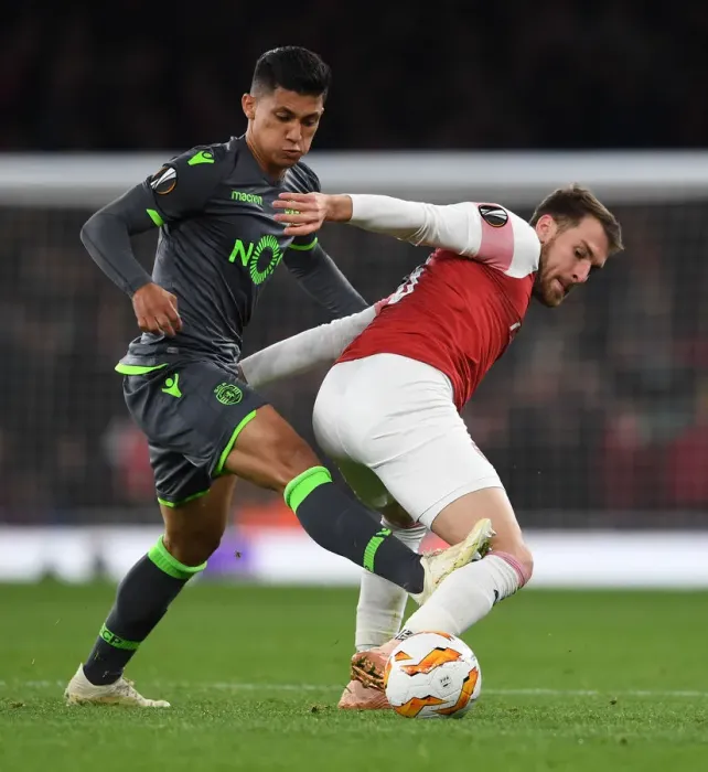 Framed Print : Clash of Midfielders: Ramsey vs. Montero in Arsenal's Europa League Battle Framed Print : Clash of Midfielders: Ramsey vs. Montero in Arsenal's Europa League Battle