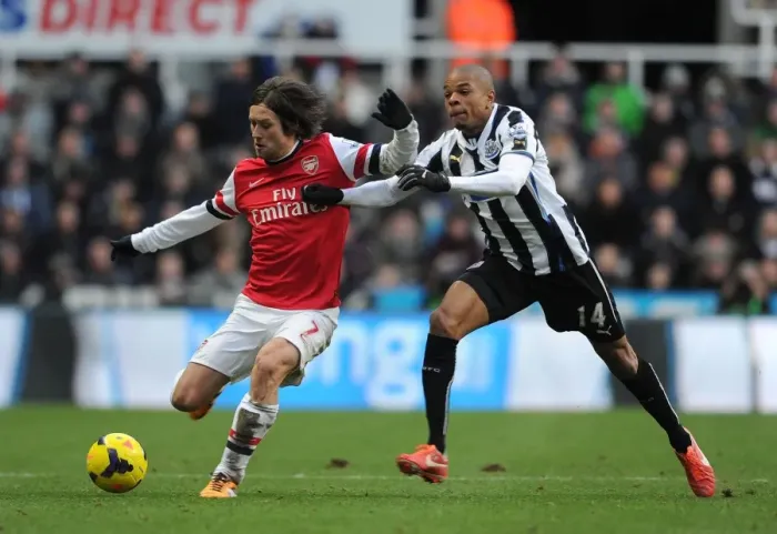 Framed Print : Clash of Midfielders: Rosicky vs. Remy in Newcastle v Arsenal Premier League Showdown