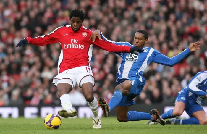 Framed Print : Clash of the Midfielders: Song vs. Palacios in Arsenal's 1-0 Win over Wigan, 2008