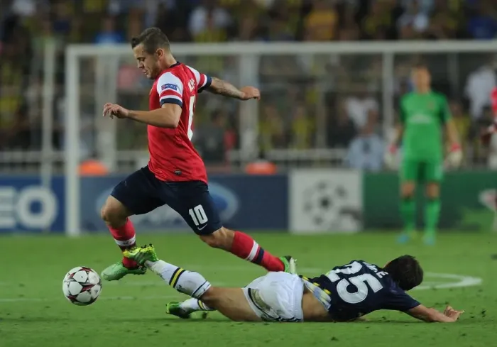 Framed Print : Clash of Midfielders: Wilshere vs. Belozoglu - Fenerbahce vs. Arsenal, UEFA Champions League Play-offs
