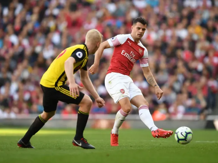 Framed Print : Clash of Midfielders: Xhaka vs Hughes in Arsenal's Battle Against Watford
