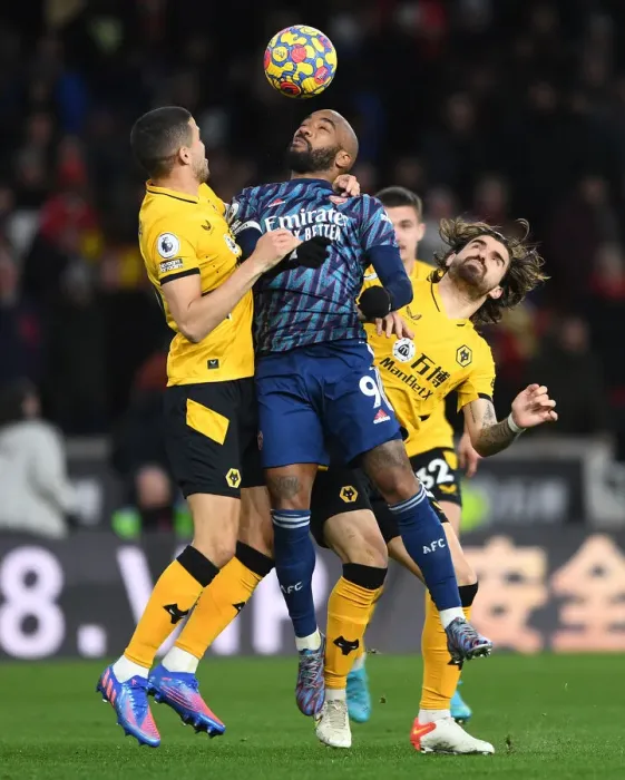 Framed Print : Clash at Molineux: Lacazette Faces Off Against Coady and Neves in Intense Wolverhampton Wanderers vs. Arsenal Premier League Showdown