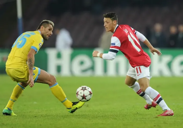 Framed Print : Clash in Naples: Ozil vs. Behrami - Napoli v Arsenal, UEFA Champions League, 2013