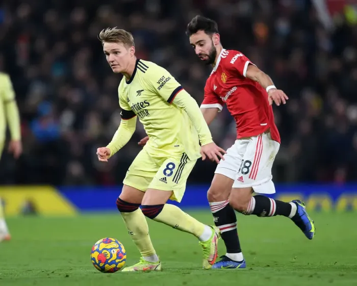 Framed Print : Clash at Old Trafford: Martin Odegaard vs Bruno Fernandes - Manchester United vs Arsenal, Premier League 2020-21 Framed Print : Clash at Old Trafford: Martin Odegaard vs Bruno Fernandes - Manchester United vs Arsenal, Premier League 2020-21