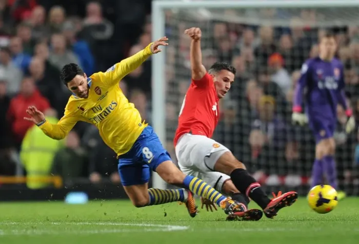 Framed Print : Clash of the Past: Arteta vs. van Persie - A Titanic Battle between Former Arsenal Stars in the Manchester United vs. Arsenal Premier League Clash (2013-14)