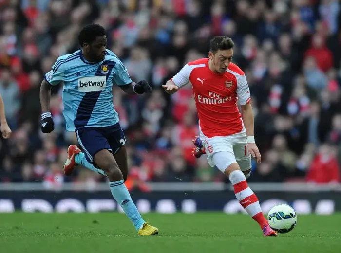 Framed Print : Clash of the Past Teammates: Ozil vs Song in Arsenal vs West Ham United (2015)