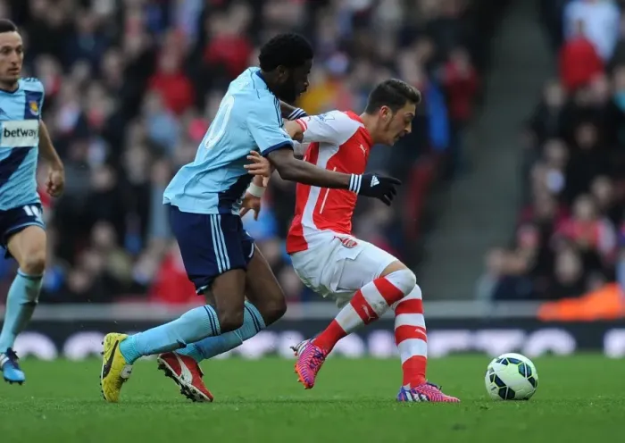 Framed Print : Clash of the Past Teams: Ozil vs. Song - Arsenal vs. West Ham United (2015)