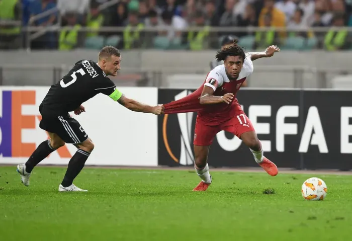 Framed Print : Clash of Players: Alex Iwobi vs. Maksim Medvedev in Qarabag vs. Arsenal Europa League Match