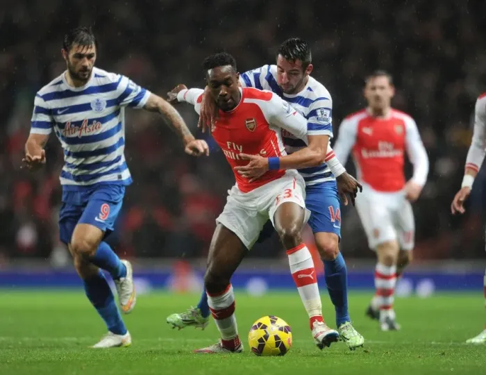 Framed Print : Clash of the Players: Welbeck vs. Isla in Arsenal's Battle with QPR