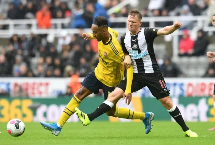 Framed Print : Clash of the Premier League Stars: Aubameyang vs. Ritchie - Arsenal's Star Forward Meets Newcastle's Midfield Maestro