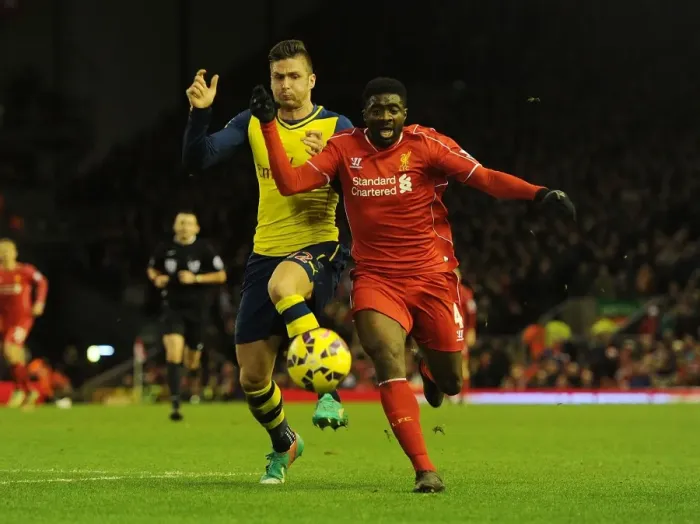 Framed Print : Clash of the Reds: Giroud vs. Toure - A Battle of Arsenal and Liverpool Rivals